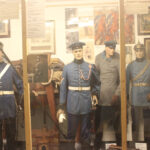 Historical German Empire military uniforms displayed in a museum case